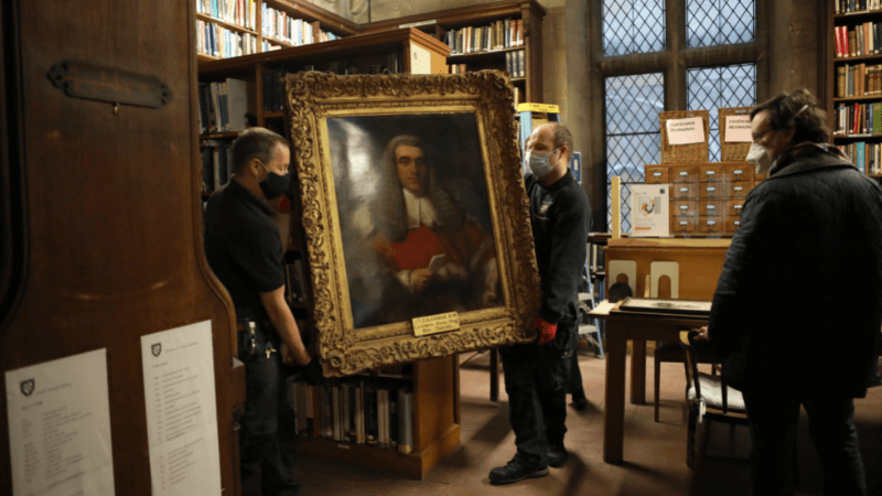 Artwork being removed from the Library for restoration and cleaning. 